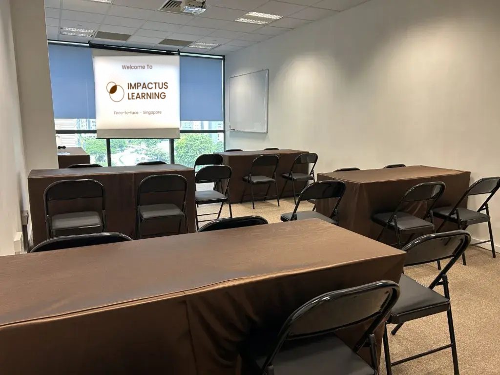 The face-to-face classroom at Paya Lebar Square, Singapore &mdash; tables and chairs set out for a small hands-on class, with a screen at the front.
